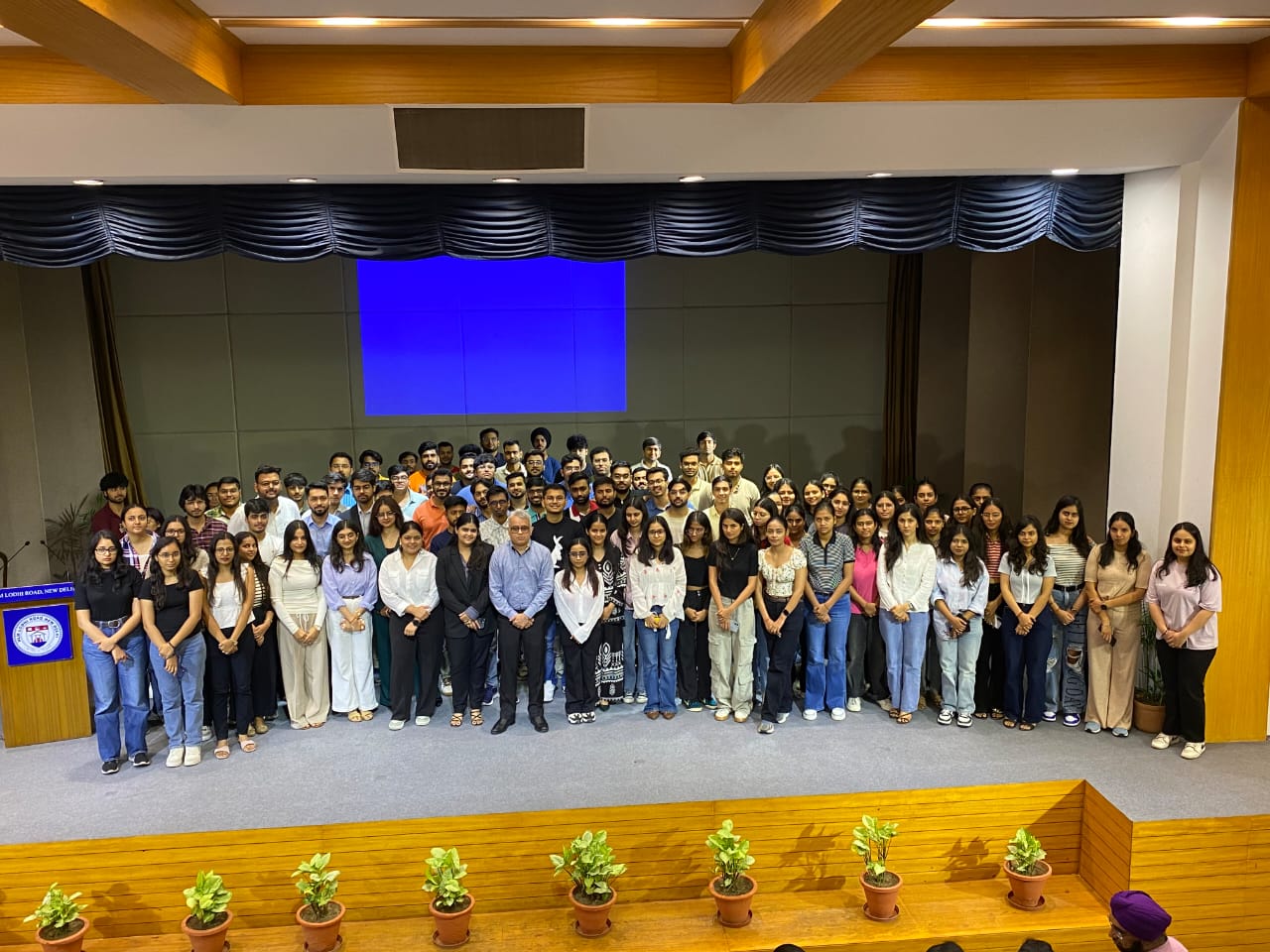 Amit Nand Mohla with a large student audience